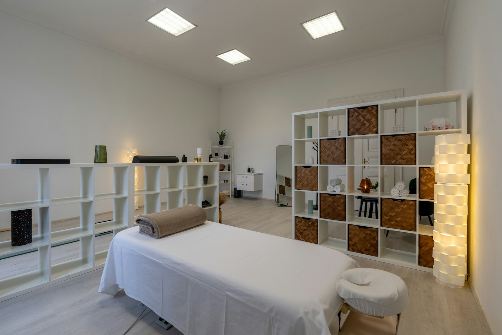 A calm, softly lit treatment room ready for a session